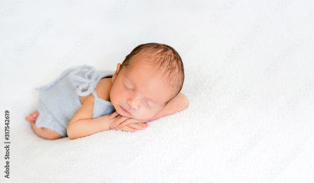 Cute newly arrived baby lying, wrapped in blanket Cute newly arrived baby lying, wrapped in blanket