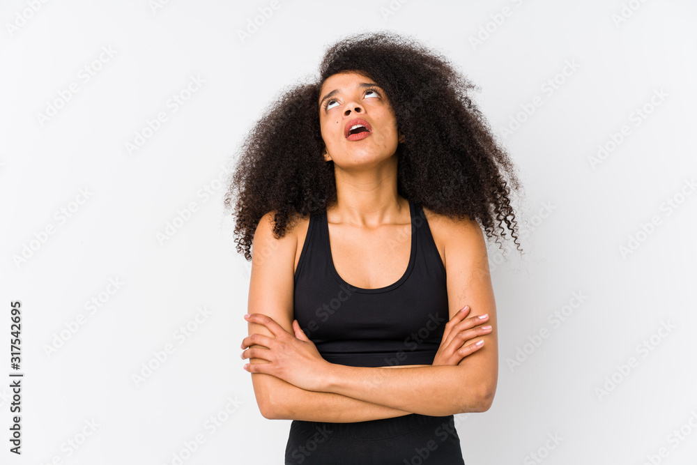 Young african american sporty woman tired of a repetitive task. Young african american sporty woman tired of a repetitive task.