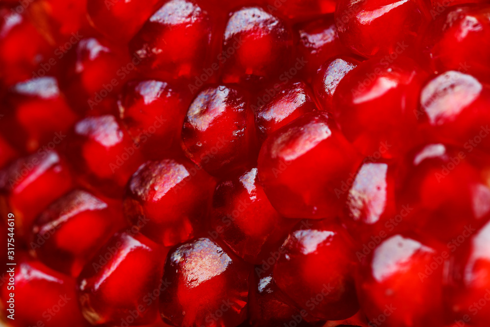 Red ripe and juicy seeds of fresh pomegranate fruit close-up. Red ripe and juicy seeds of fresh pomegranate fruit close-up.