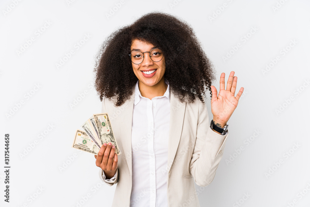 Young afro business woman holding a credit car isolated Young afro business woman holding a credit carsmiling cheerful showing number five with fingers. Young afro business woman holding a credit car isolated Young afro business woman holding a credit carsmiling cheerful showing number five with fingers.
