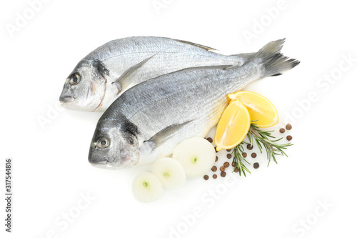 Fresh Dorado fishes and spices isolated on white background