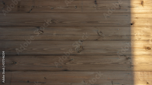 wooden texture background. the Board is light Golden ochre horizontally shadow and light