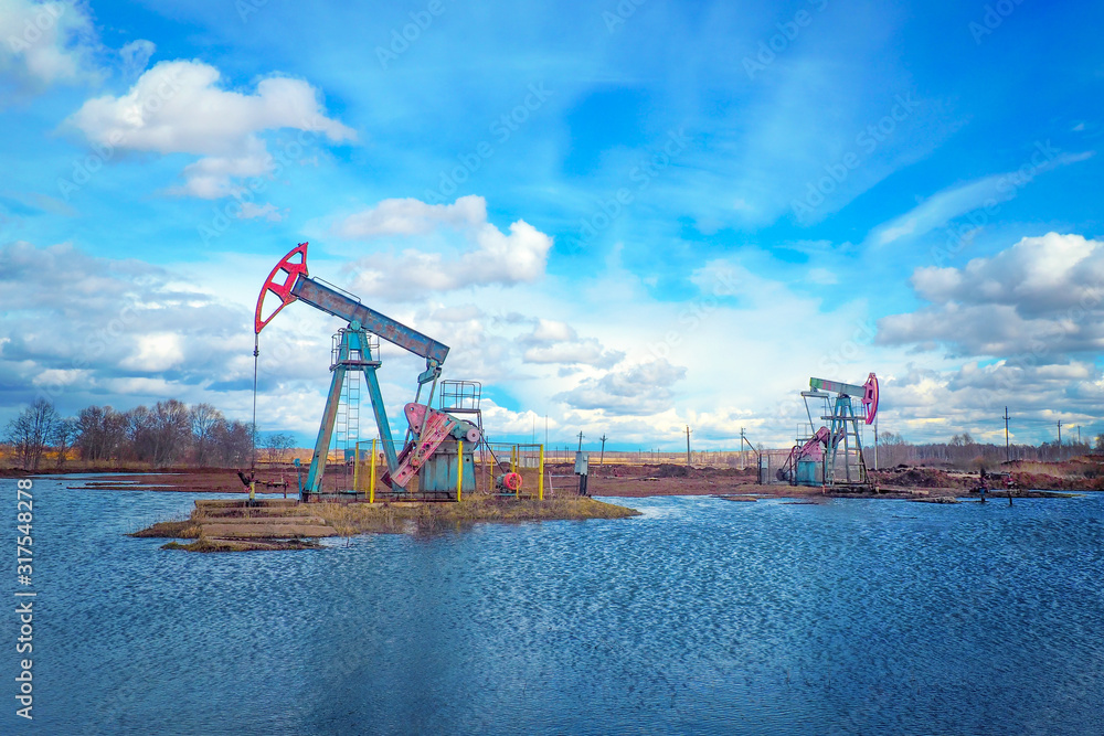 Oil and gas industry. Work of oil pump jack on a oil field. Modern