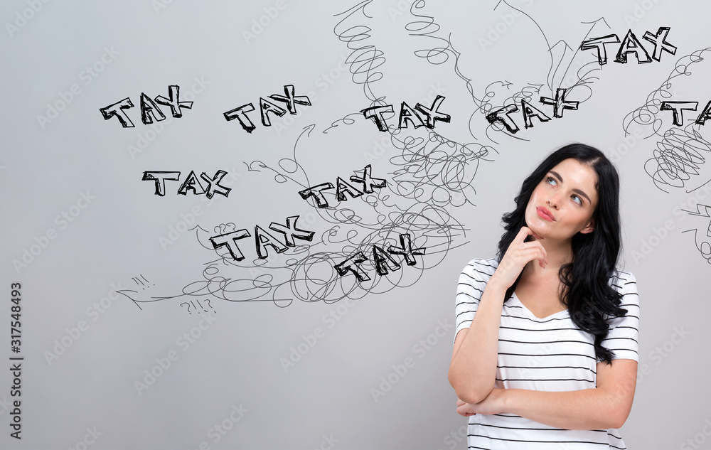 Tax problem theme with young woman in a thoughtful face Tax problem theme with young woman in a thoughtful face