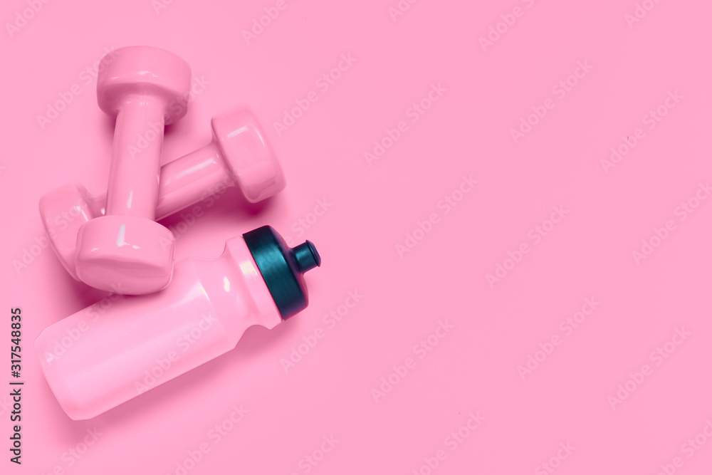 Fitness workout background concept with pink dumbbells and bottle of water.  Top view flatlay sport, diet and healthy lifestyle with training equipment  on pink background with blank copy space. Stock-bilde