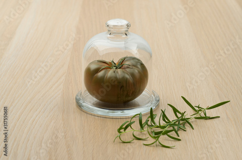 Homegrown tomatoes and garlic on the wooden background