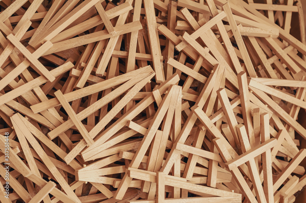Lots of wooden phone stands piled in a pile Lots of wooden phone stands piled in a pile