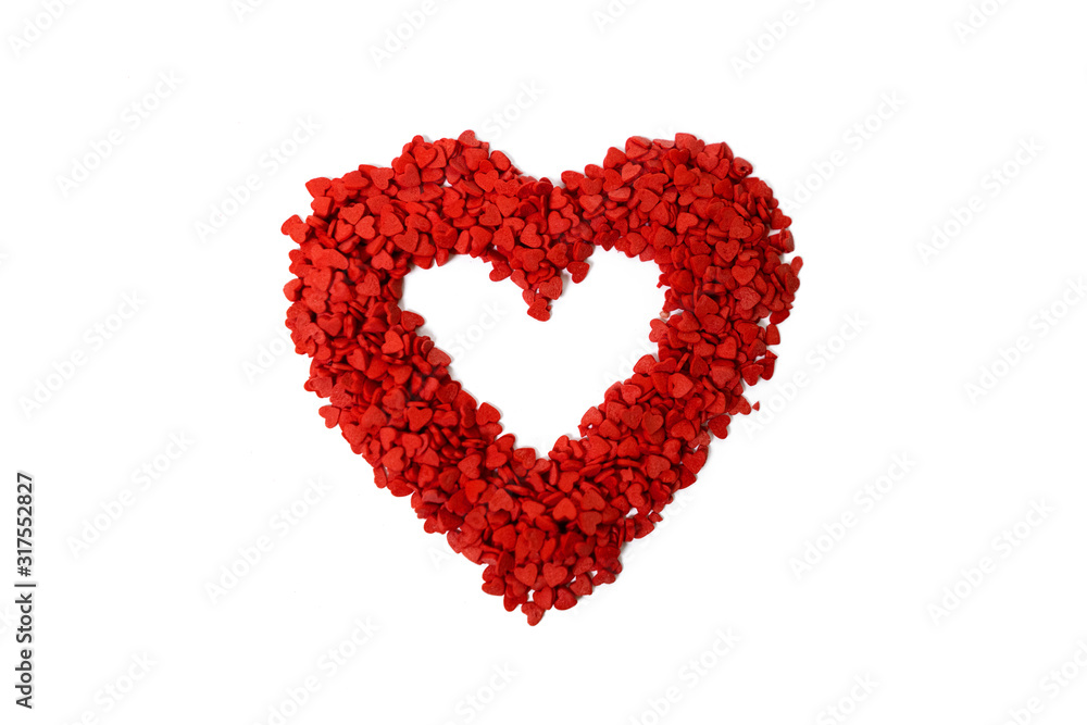 Close up of Red Heart Made of Sugar Sprinkle Dot Hearts, Decoration for Cake and Bakery on White Background Close up of Red Heart Made of Sugar Sprinkle Dot Hearts, Decoration for Cake and Bakery on White Background