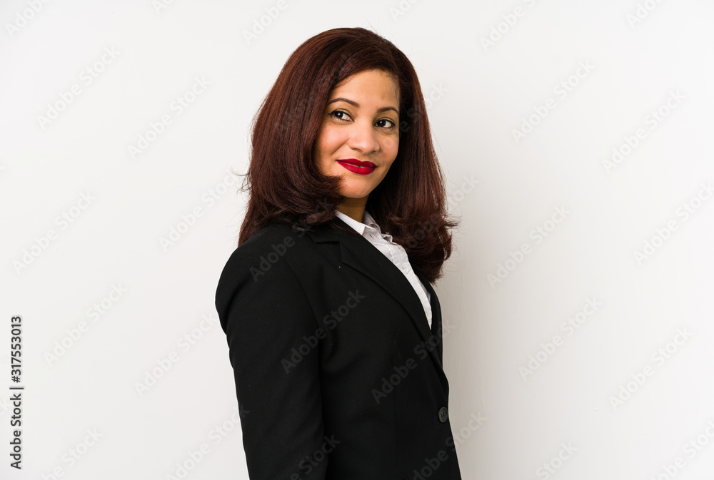 Middle age latin business woman isolated looks aside smiling, cheerful and pleasant. Middle age latin business woman isolated looks aside smiling, cheerful and pleasant.