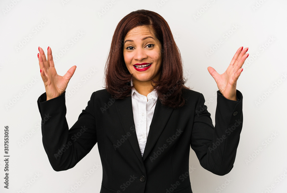 Middle age latin business woman isolated receiving a pleasant surprise, excited and raising hands. Middle age latin business woman isolated receiving a pleasant surprise, excited and raising hands.