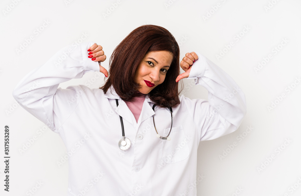 Middle age latin doctor woman isolated feels proud and self confident, example to follow. Middle age latin doctor woman isolated feels proud and self confident, example to follow.