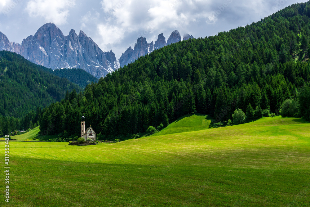 Scenic view of St Johann Church. Santa Maddalena village, Dolomites, Val di Funes, Italy.