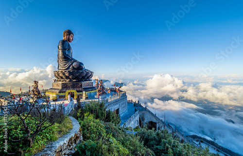 Landscape with .Giant Buddha statue on the top of mount Fansipan, Sapa region,  Lao Cai, Vietnam photo