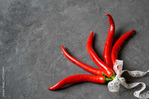 Red chili peppers on a gray background