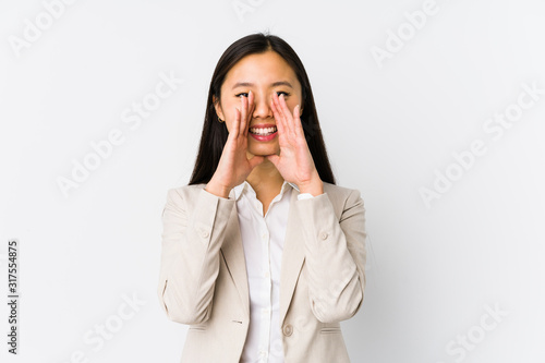 Young chinese business woman isolated shouting excited to front.
