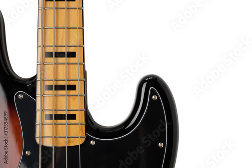 Close Up to neck and body part of Sunburst 4 string jazz bass guitar isolated on white background.