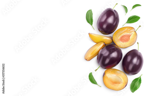 fresh purple plum and half with leaves isolated on white background with clipping path and copy spase for your text. Top view. Flat lay