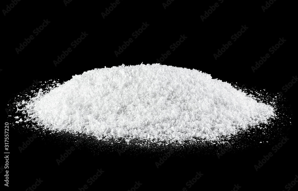 White snow on a black background, close-up.