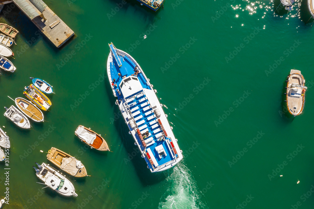 Cruise ship at harbor. Aerial view of beautiful yacht and boats in marina bay