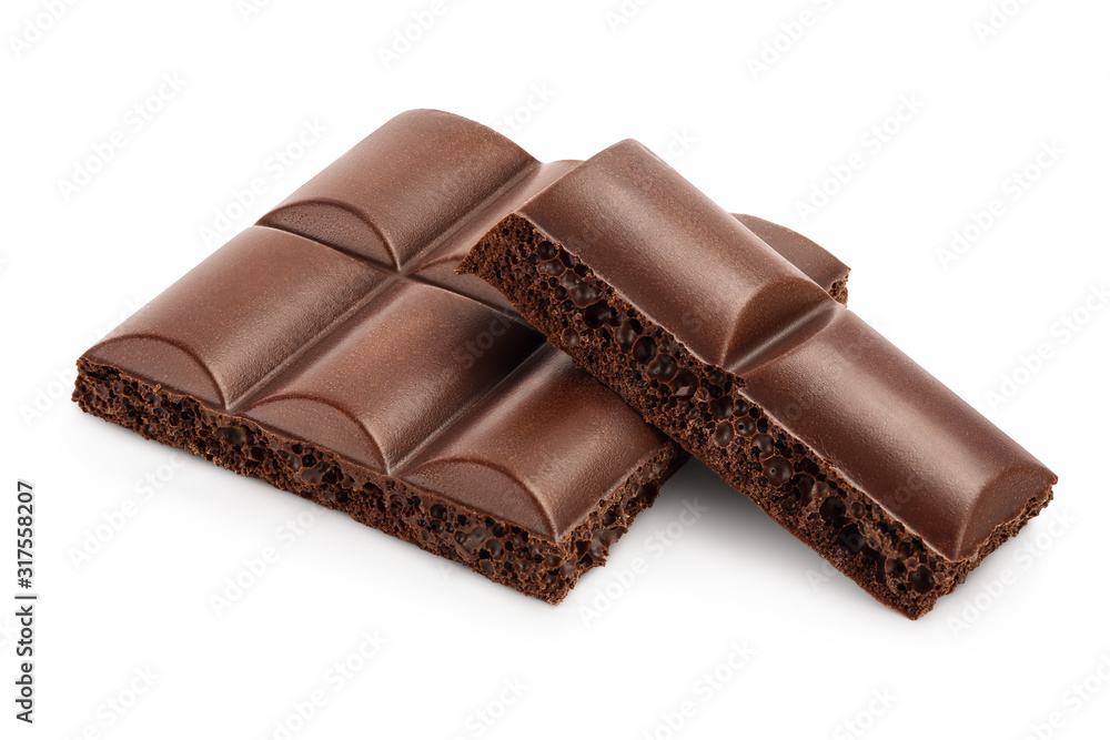 Small dark chocolate pieces isolated on white background with clipping path Small dark chocolate pieces isolated on white background with clipping path