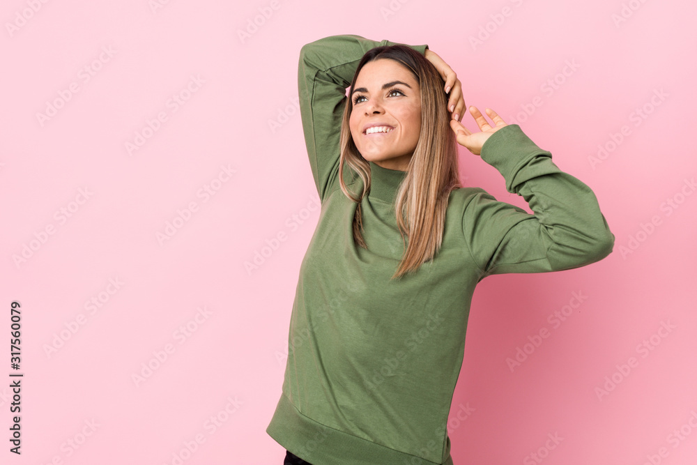 Young caucasian woman isolated stretching arms, relaxed position. Young caucasian woman isolated stretching arms, relaxed position.
