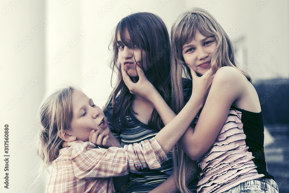 Group of happy teen girls on city street Group of happy teen girls on city street
