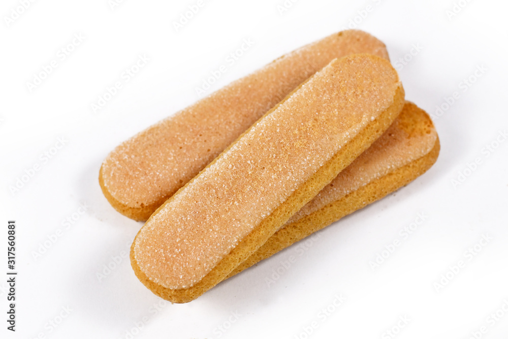 Low density, dry, egg based, sweet sponge biscuits roughly shaped like a large finger called 'ladyfinger' on white background Low density, dry, egg based, sweet sponge biscuits roughly shaped like a large finger called 'ladyfinger' on white background
