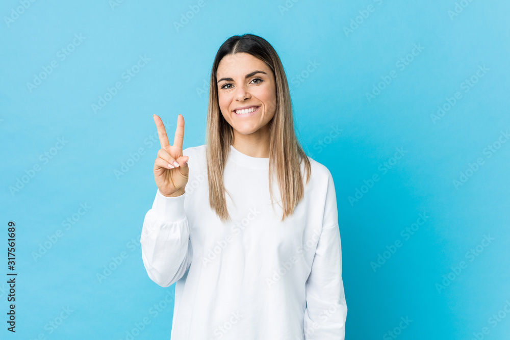 Young caucasian woman isolated showing number two with fingers. Young caucasian woman isolated showing number two with fingers.