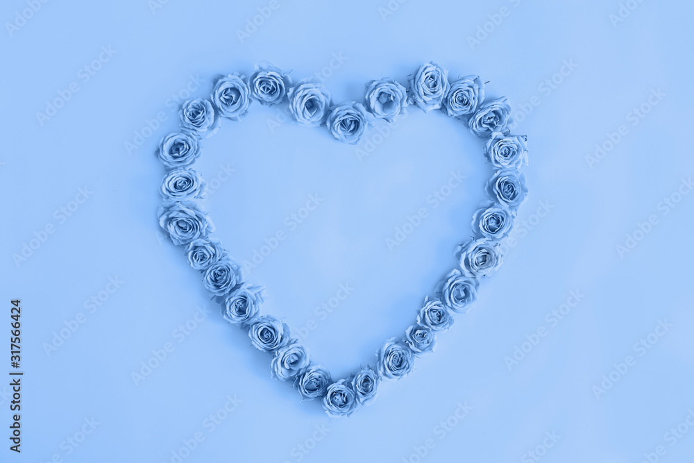 Beautiful heart made roses in a classic blue color on a blue background. I love you. Greeting card.Valentine's day.Woman's day.isolated Beautiful heart made roses in a classic blue color on a blue background. I love you. Greeting card.Valentine's day.Woman's day.isolated