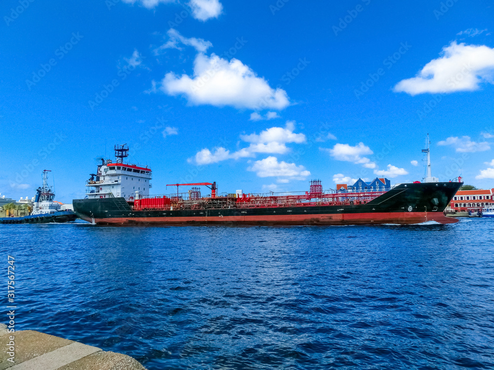 Tanker ship entering Willemstad , Konigin Juliana Bridge in the background Curacao