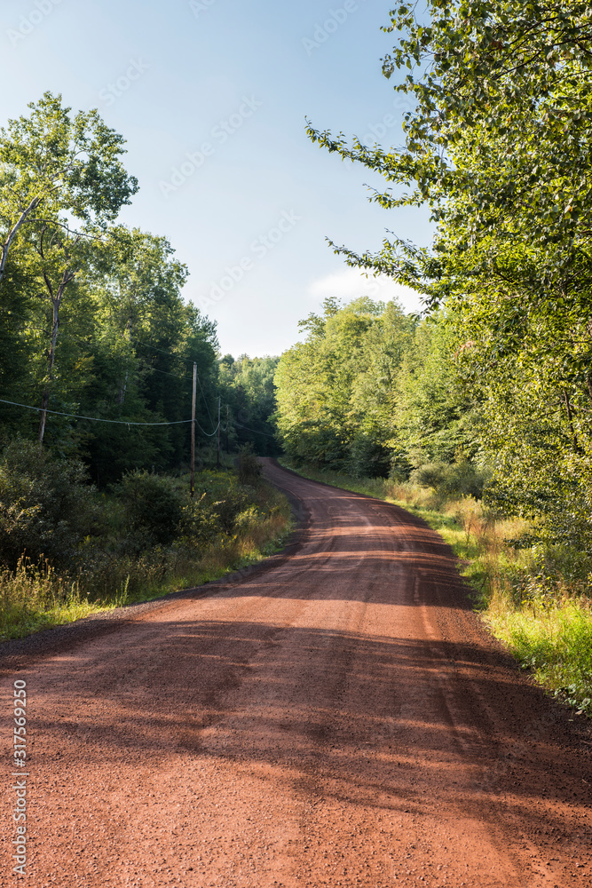 Red clay winding road, Bovina, New York, USA. Red clay winding road, Bovina, New York, USA.