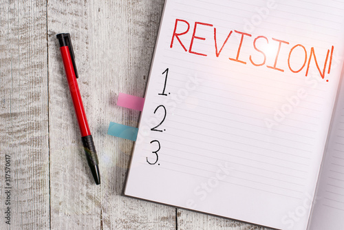Obraz na płótnie Handwriting text writing Revision. Conceptual photo action of revising over someone like auditing or accounting Thick pages notebook stationary placed above classic look wooden backdrop w salonie
