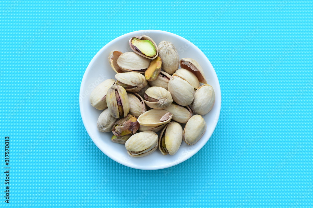 Pistachios in colorful and natural backgrounds Pistachios in colorful and natural backgrounds