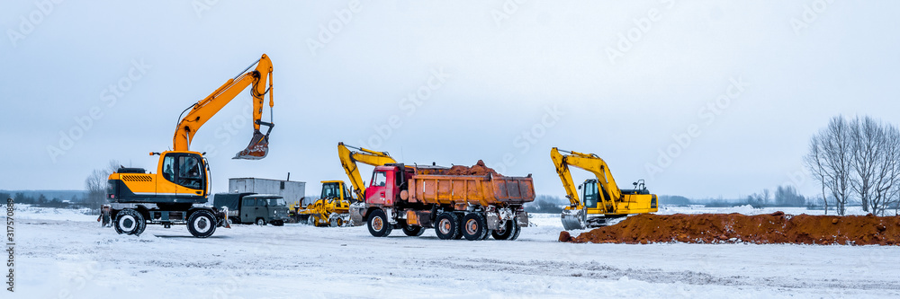 Construction truck tipping dumping gravel on road construction site,tip truck and ripper at work preparing ground for new housing estate,Dump truck unloading process Construction truck tipping dumping gravel on road construction site,tip truck and ripper at work preparing ground for new housing estate,Dump truck unloading process