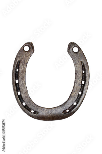 Horseshoe isolated. Close-up of metal horse shoe as a symbol of good luck, prosperity and of a happy future isolated on a white background. Macro photograph. Front and back view.