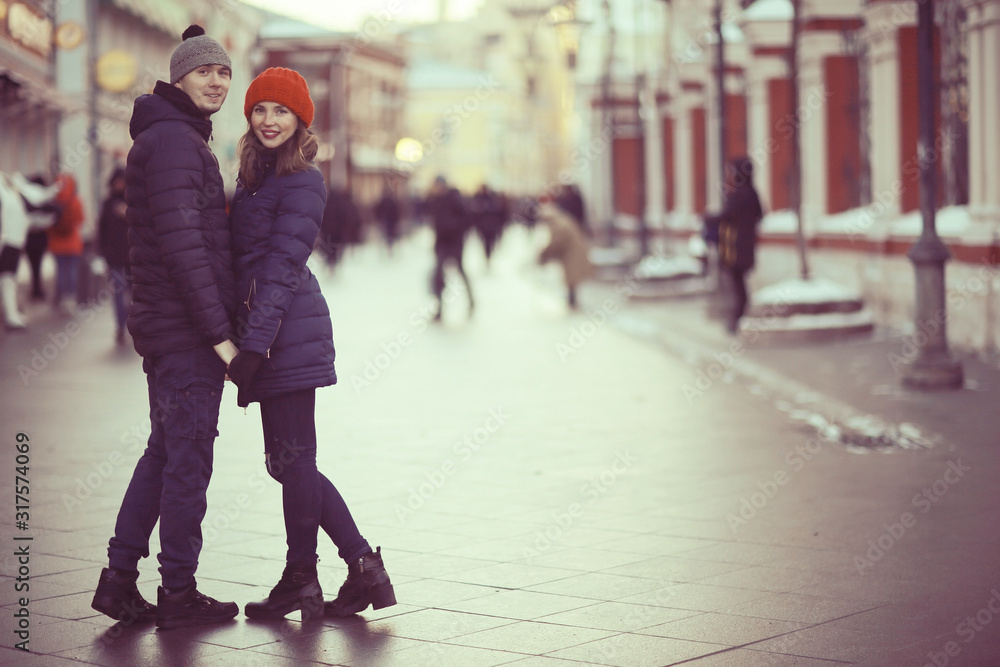 couple snowing city street
