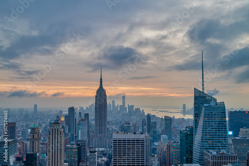 New York skyline from The Top of The Rock at sunset with clouds in the sky in the background © Mohamed