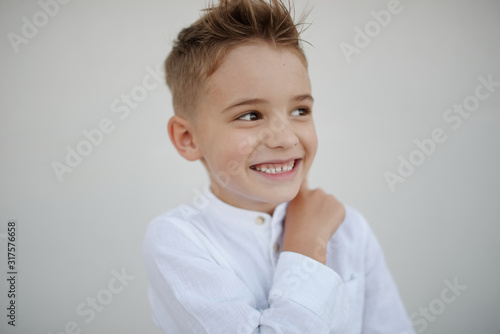 portrait of young handsome boy with stylish haircut
