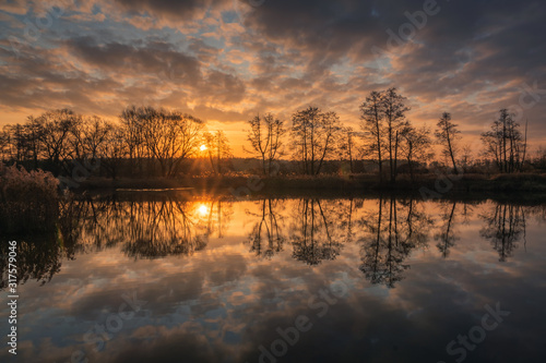 Sunrise over the pond in Zalesie Dolne near Piaseczno, Poland