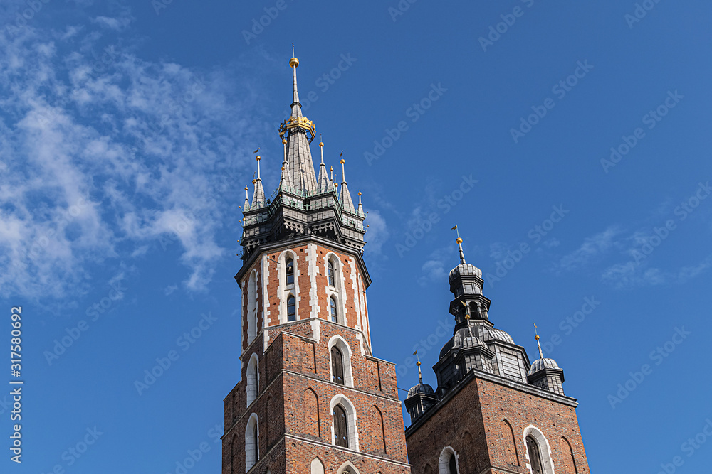 Beautiful Basilica of St. Mary's (13th century) in historical center of Krakow - Market Square (Rynek Glowny). Krakow, Poland. 