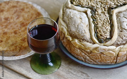 Homemade decorated Serbian slava bread on the rustic wooden board. photo