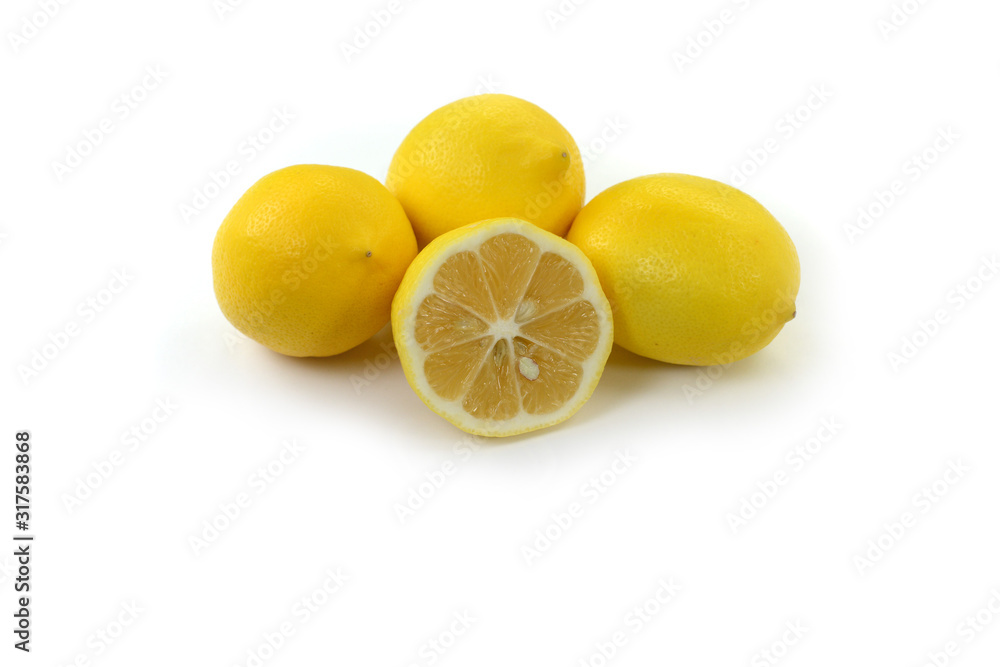 Heap of lemon. Juicy yellow slice of lemon on a white background isolated. Cut lemon fruits isolated on white background. Heap of lemon. Juicy yellow slice of lemon on a white background isolated. Cut lemon fruits isolated on white background.