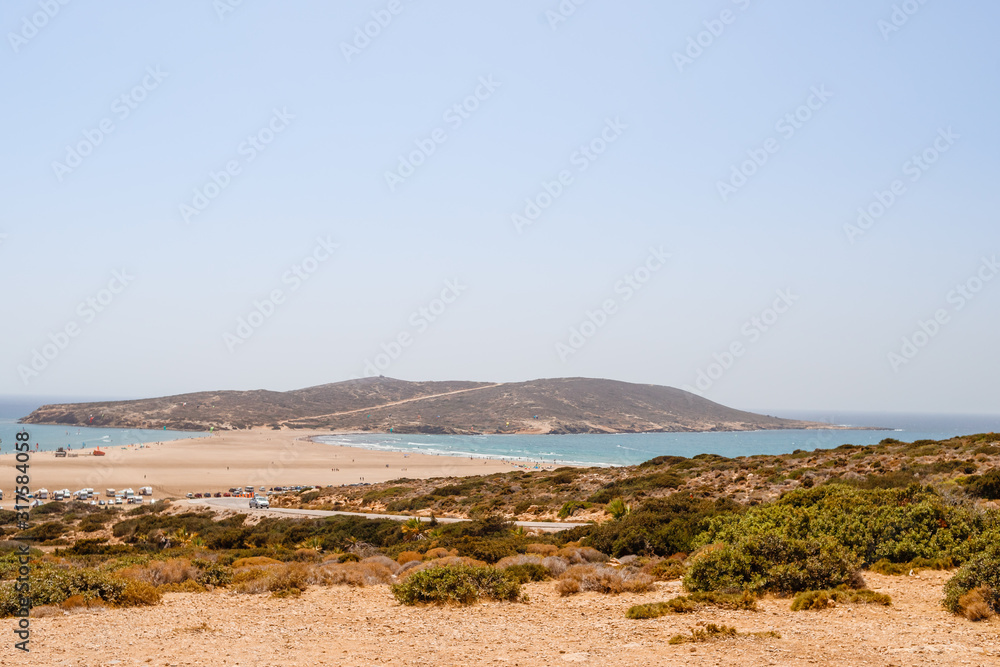 Greece. Rhodes. Prassonisi ,the Kiss of two seas. Good place for Kite surfing, Windsurfing, Aegean Sea.Sandy beach in Prasonisi, Rhodes. Summer vacation in Greece. Travel concept. Greece. Rhodes. Prassonisi ,the Kiss of two seas. Good place for Kite surfing, Windsurfing, Aegean Sea.Sandy beach in Prasonisi, Rhodes. Summer vacation in Greece. Travel concept.
