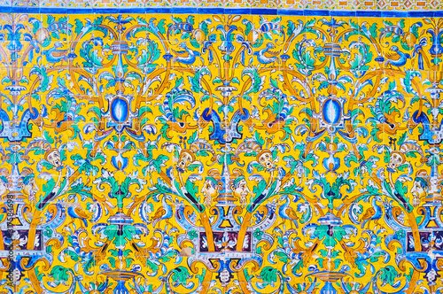 The Andalusian styled tiled wall in Alcazar Palace complex in Seville, Spain