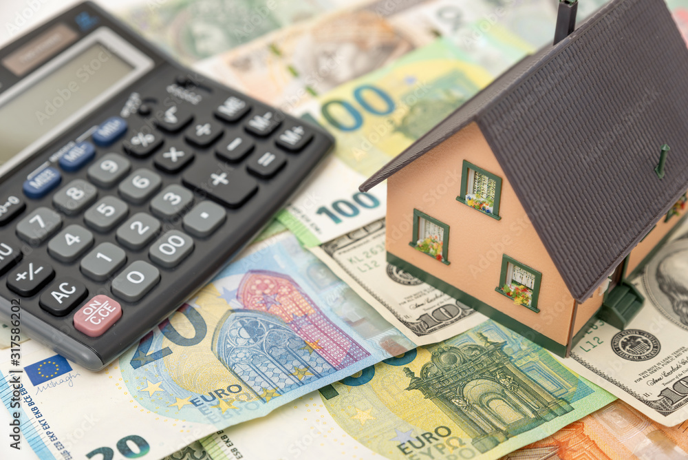 House model on banknotes, investment concept House model on banknotes, investment concept