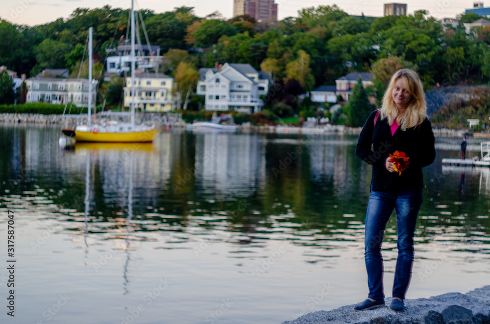 Fototapeta premium Woman walking around Halifax harbor