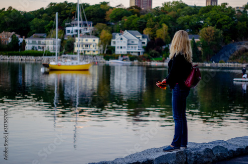 Woman walking around Halifax harbor © Aleksei