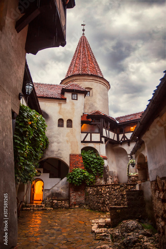 Inside Bran Castle in Transylvania. Inner yard in a summer rainy day. The dark Castle of Count Dracula Brasov, Romania