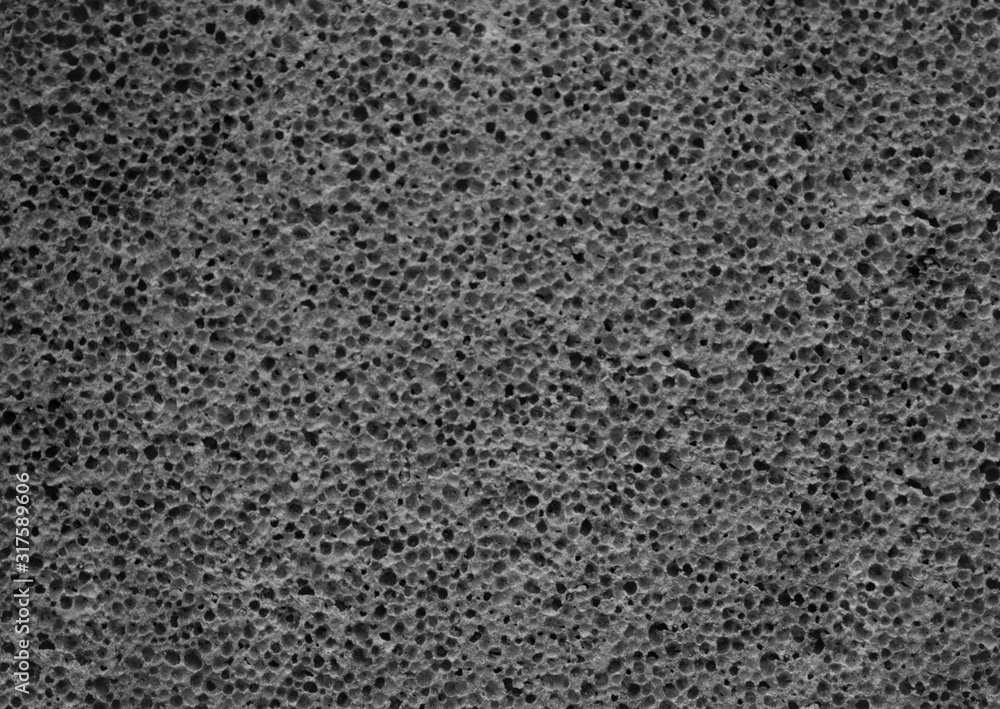 Gray pumice stone texture close up. Porous pumice background. Stock