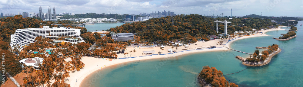 Panoramic aerial view of Siloso Beach and Sentosa Island at sunset, Singapore